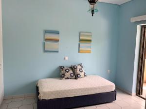 Кровать или кровати в номере Villa Kavos - Isthmia Corinth