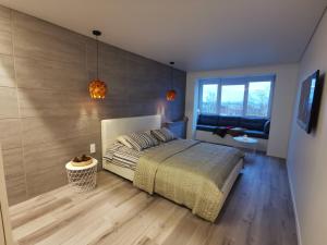 Postel nebo postele na pokoji v ubytování Buto nuoma Dariaus ir Girėno gatvėje