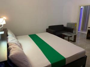 En eller flere senge i et værelse på Hgl Guest House
