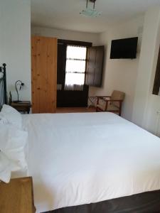 Posteľ alebo postele v izbe v ubytovaní Hotel Rural Xerete