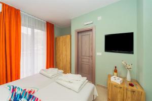 Μια τηλεόραση ή/και κέντρο ψυχαγωγίας στο ApartHotel Solaris