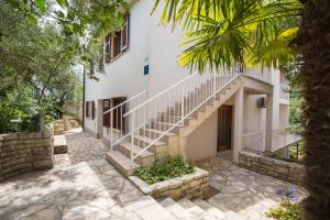 a building with stairs in front of it at Apartments Sveta Marina in Labin
