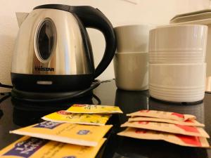 a black counter with a coffee maker and some food at I Limoni di Vernazza in Vernazza +7 photos