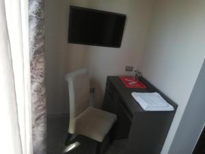 TV a/nebo společenská místnost v ubytování Hotel Ponti