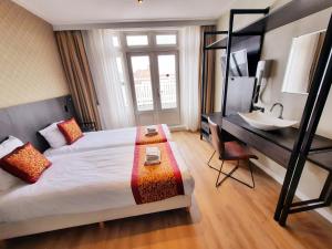 Postel nebo postele na pokoji v ubytování Hotel Washington