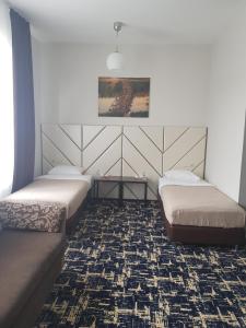 Кровать или кровати в номере Отель Покровское-Дивное