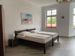 Postel nebo postele na pokoji v ubytování Villa am Meer - Stralsund
