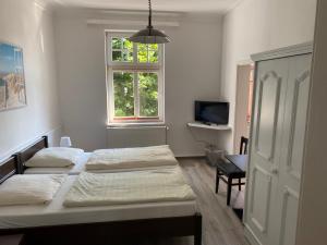 Postel nebo postele na pokoji v ubytování Villa am Meer - Stralsund