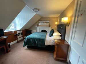 Katil atau katil-katil dalam bilik di Invergarry Hotel