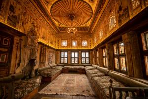 a large room with couches and a chandelier at Henna Hotel-Adults Only in Göreme