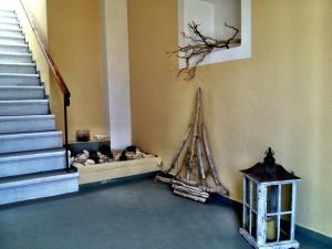 a room with stairs and a boat on the wall at Kiki Studios in Fiskardo