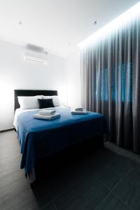 Postel nebo postele na pokoji v ubytování Athena Center Apartments