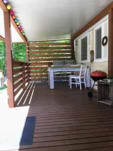 a screened in porch with a table and chairs on it at Istria camp - Istria holiday for 2 in Kringa