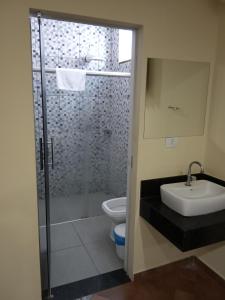 Phòng tắm tại POUSADA FAROL DE ALEXANDRIA LTD - ME