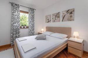 Postel nebo postele na pokoji v ubytování Apartments Fijan (A2)