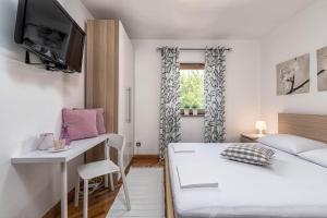 Postel nebo postele na pokoji v ubytování Apartments Fijan (A2)
