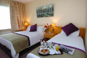 Krevet ili kreveti u jedinici u okviru objekta Knock House Hotel