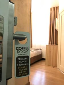 a door to a room with a sign on it at Coffee Room in Odesa