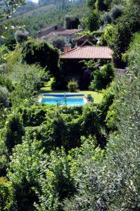 an aerial view of a yard with two swimming pools at Quinta Das Escomoeiras in Celorico de Basto