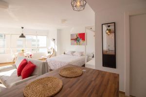 a living room with a couch and a bed at MADRID 810 in Torrox Costa +72 photos