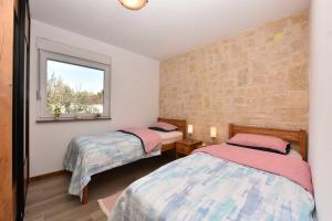 Posteľ alebo postele v izbe v ubytovaní Stone House Pridraga + 25 fotografií