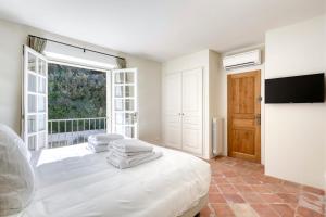 Postel nebo postele na pokoji v ubytování Villa Le mas de Galassa - Ramatuelle