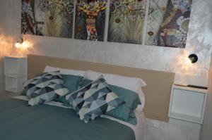 A bed or beds in a room at B&b Ilary Home