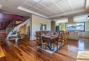 a dining room with a long table and chairs at Exclusive VILLA Volme in Banjole