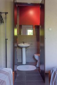 a bathroom with a sink and a toilet at Ośrodek Edward in Mikoszewo +112 photos