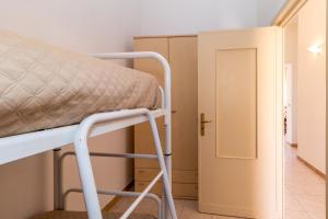 Postel nebo postele na pokoji v ubytování Casa Spiaggia Molo 4