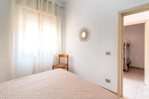 Postel nebo postele na pokoji v ubytování Casa Spiaggia Molo 4