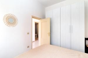 Postel nebo postele na pokoji v ubytování Casa Spiaggia Molo 4