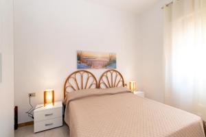 Postel nebo postele na pokoji v ubytování Casa Spiaggia Molo 4