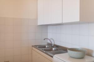 Kuchyň nebo kuchyňský kout v ubytování Casa Spiaggia Molo 4