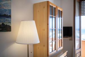TV a/nebo společenská místnost v ubytování Casa Spiaggia Molo 4