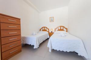 Postel nebo postele na pokoji v ubytování Apartamentos Nuevo México C 132