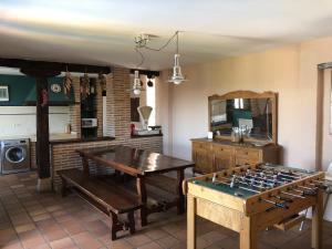 a living room with a table and a game board at El Pósito in Hita