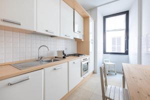 Kuchyňa alebo kuchynka v ubytovaní maison Colosseo