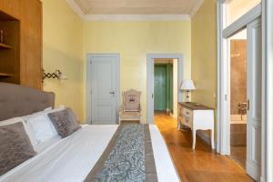 Posteľ alebo postele v izbe v ubytovaní maison Colosseo