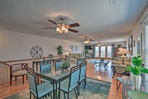 a dining room and living room with a ceiling fan at Murrells Inlet Home with 3 Decks - 1 Block to Beach! in Myrtle Beach