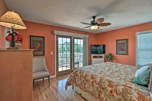 a bedroom with a bed and a ceiling fan at Murrells Inlet Home with 3 Decks - 1 Block to Beach! in Myrtle Beach