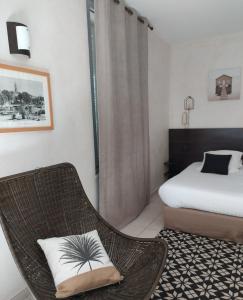 Postel nebo postele na pokoji v ubytování hôtel Le Synaya