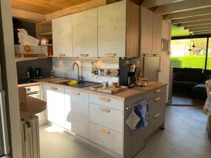 a kitchen with a sink and a counter top at Ysermonde Fisherman's Cottage in Nieuwpoort