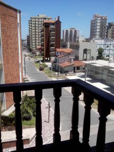 a view of a city street from a balcony at Hotel Montecarlo in Villa Gesell