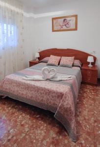 Łóżko lub łóżka w pokoju w obiekcie Villa del Carmen