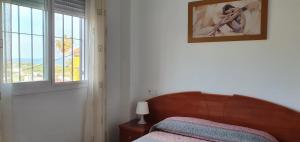Łóżko lub łóżka w pokoju w obiekcie Villa del Carmen