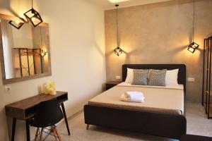 A bed or beds in a room at Studios Periklis