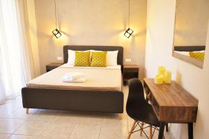 A bed or beds in a room at Studios Periklis