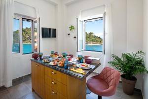 a kitchen with a table with food on it at Sea Front Suite "SEA TALES" in Gaios