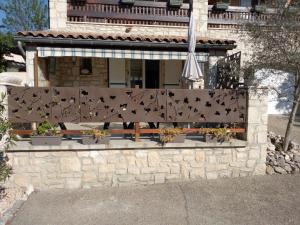 a building with a bench with birds on it at Les Lauriers Roses in Salavas